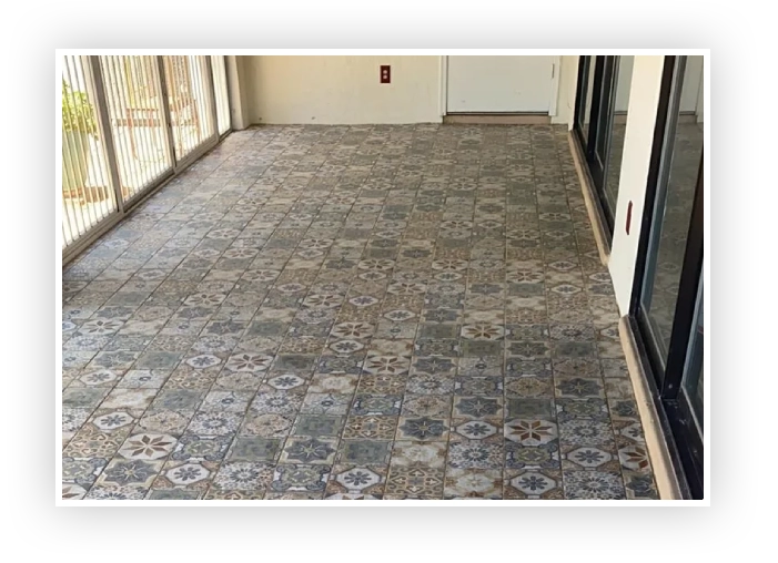 A tile floor with many different patterns on it